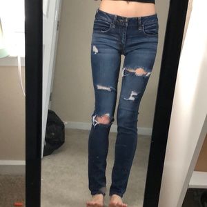 Dark blue ripped jeans